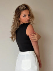 ASYMMETRIC SLEEVELESS METAL EYELET DECOR TOP